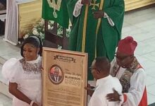 Nii Adjiri-Blankson and wife receive the Citation of Honour from the church