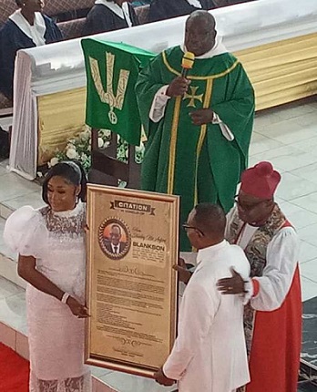 Nii Adjiri-Blankson and wife receive the Citation of Honour from the church