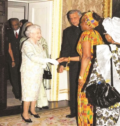 D Anie(second right) in handshake with the Queen