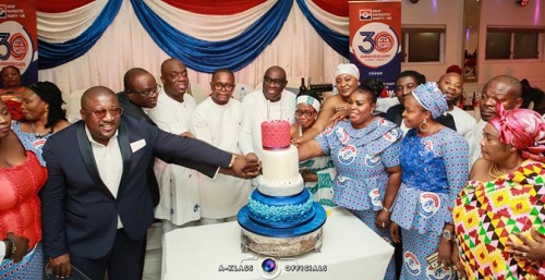 • Dignitaries cutting the anniversary cake at the programme