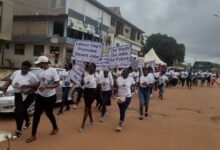 Participants marching through the principal streets of Sunyani