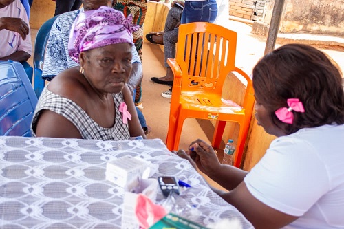 A participant, (left), going through screening.