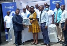 Mr Ashong (left) presenting one of the monitors to Dr Nyarko, whilst Dr Glover-Addy (third from left) and staff of the hospital, Provident Insurance Company look on