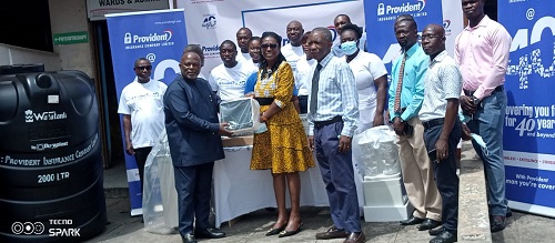 Mr Ashong (left) presenting one of the monitors to Dr Nyarko, whilst Dr Glover-Addy (third from left) and staff of the hospital, Provident Insurance Company look on