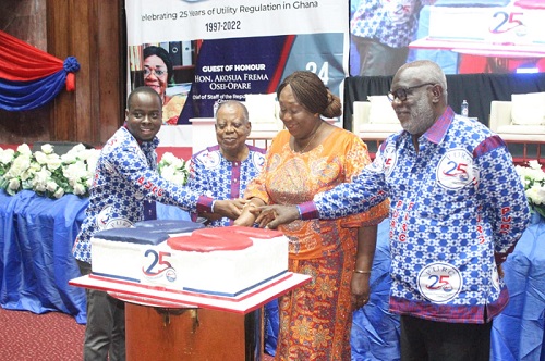 Dr Adu-Gyamfi (middle), Dr Ackah (first left), Nana Asante (second left) cutting the anniversary cake.