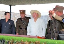Kim Jong-un (middle) presiding over the missile launches
