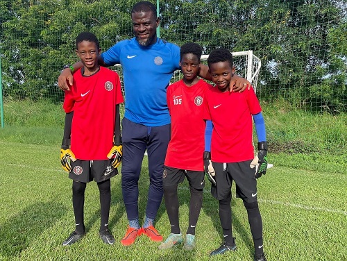 Dauda with some of the kids under training