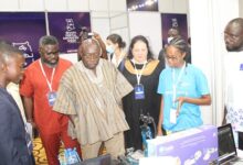 Dr Kweku Afriyie (in smock) and other dignitaries at the exhibition stand during the conference. Photo. Ebo Gorman (2)
