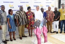 Mr Kofi Adomakoh (third from left) and other oficials after launching the VISA cards Photo Seth Osabukle