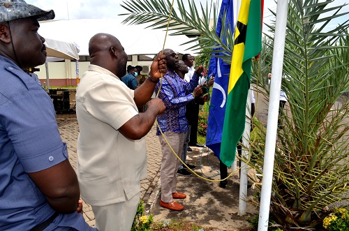 Mr Michael Okyere Baafi(second from left) with other officials of GSA raising the flags to commemorate the day. Photo. Vincent Dzatse