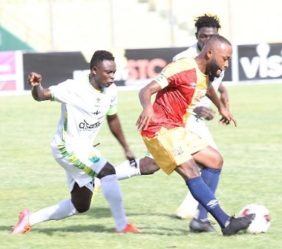 Match winner Awako given a hot chase for the ball by Godfred Kyei and Ibrahim Laar during the game