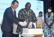 Dr Kwaku Afriyie and Jung-Taek Lim (left)cutting the anniversary cake.Photo Godwin Ofosu-Acheampong