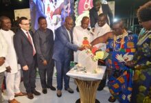 Torgbui Nyonyo Agbowada(fourth from right)with Mr Samuel Awuku(third from right),Mr Dramame Coulibaly(fourth from left)and Nii Ayibonte ll(second from right) cutting the anniversary cake.