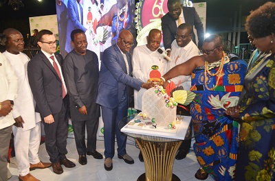 Torgbui Nyonyo Agbowada(fourth from right)with Mr Samuel Awuku(third from right),Mr Dramame Coulibaly(fourth from left)and Nii Ayibonte ll(second from right) cutting the anniversary cake.