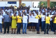 Officials of MTN Ghana with some students of Labone Senior High School in Accra