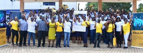 Officials of MTN Ghana with some students of Labone Senior High School in Accra