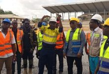 • Mr Adama (hands raised) and other engineers takes Mr Duker (second right) and his entourage around the construction site