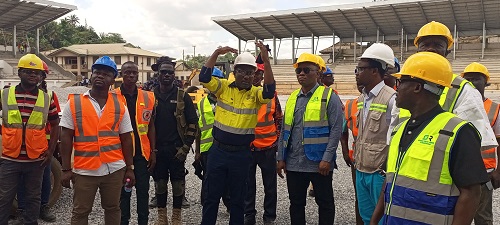 • Mr Adama (hands raised) and other engineers takes Mr Duker (second right) and his entourage around the construction site