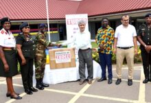 Mr. Cafer Tepel (third from right)President of TUDEC, presenting the equipment to Colonel Halidu Salifu Officer in-charge of the Dental Division of the hospital. Photo. Vincent Dzatse ,