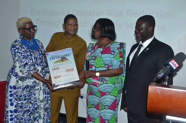 Mrs. Adelaide Anno-Kumi(second from right) receiving the documents from WFP and UNESCO Country Directors. With them is Mr Nana Agyemang-Prempeh(right) Photo Victor A. Buxton
