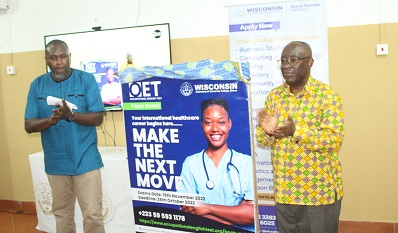 Prof. Obeng Mireku (right) and Mr Ebenezer Amuasi applauding after launching the OET programme. Photo. Ebo Gorman