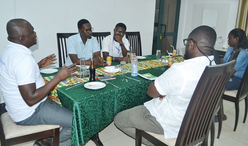 Mr Agyemang (left) interacting with journalist at the meeting Photo Victor A. Buxton