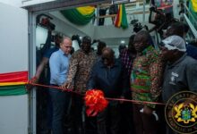 President Akufo-Addo (middle) cutting the tape to inaugurate the facility