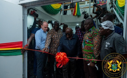 President Akufo-Addo (middle) cutting the tape to inaugurate the facility