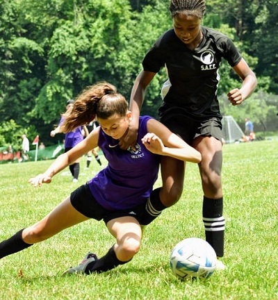 Suweba (right) displaying her strength and skill during a game