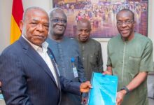 TRANSITION- Nana Dadzie (left) presenting the document to Mr Bagbin (right). Looking on are Prof Ahwoi (second, left) and Kofi Attoh, an official in the Office of The Speaker of Parliament