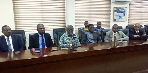 Dr Anthony Nsiah-Asare (middle) addressing the media. With him are other members of the inter-ministerial committee