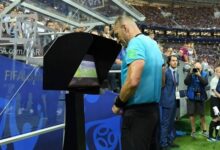 VAR: A referee crosschecking an incident