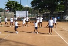 A section of the tennis youngsters warm up before the matches