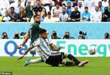 Argentina's Romero makes a timely clearance in yesterday's game