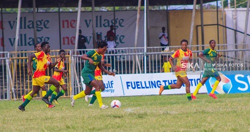 • Army Ladies Harriet Akoukor Adjetey controls the ball past her markers during their game with Hasaacas
