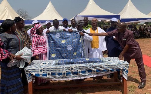 Some of the dignitaries unveiling the schools anniversary cloth