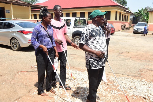 Some blind persons using the white cane