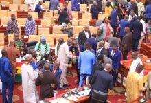Parliamentarians from both sides of the house interacting after the budget presentation Photo Victor A. Buxton