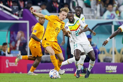 • De Jong of the Netherlands is challenged in this scene by a Senegalese marker
