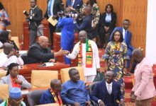 • Mr Ken Ofori-Atta being welcomed by parliamentarians to the floor of parliament Photo: Victor A. Buxton