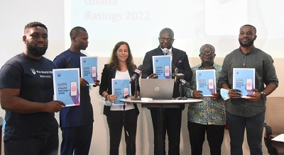Mr Bryan Acheampong (third from right) being assisted by other dignitaries to launch the report Photo Michael Ayeh