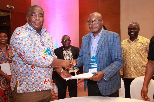 • Mr Mac-Anthony Cobblah(left) Chairman CARLIGH exchanging the signed Mou with Mr Lucas Chigabatia, CEO, GARNET