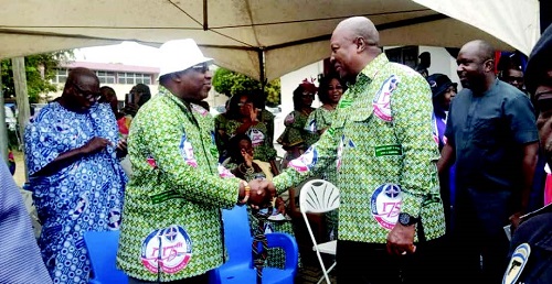 • Former President John Mahama, (right) exchanging greetings with the Moderator