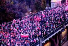 • FLASHBACK: People take part in the March of Independence 2019 as they walk on the Poniatowski Bridge in Warsaw, Poland
