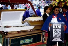 South Africans mourn slain anti-apartheid leader, Chris Hani, as his body lies in state in Johannesburg in April 1993.