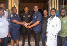 • Mr Hodzi (middle) presenting a hearing kit to the police