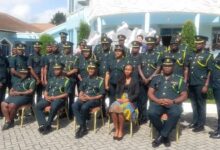 Mr Takyi, (3rd from right) with management of GIS, Regional commanders