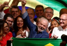 Inacio Lula da Silva waves at his supporters after being elected president in Sunday's election
