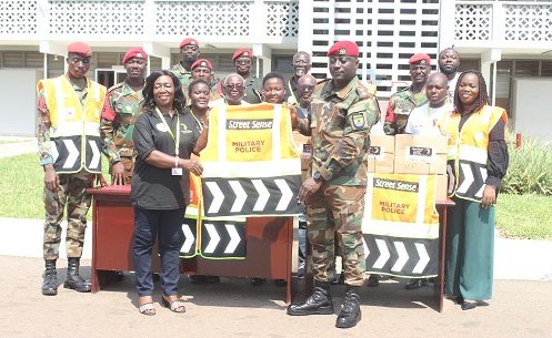 • Mrs Gloria Laryea (left) presenting the vests to Lt Col David Addi. With them are other officials Photo Anita Nyarko-Yirenkyi