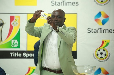 • Chairman of the MTN FA Cup Committee, Wilson Arthur, drawing one of the teams